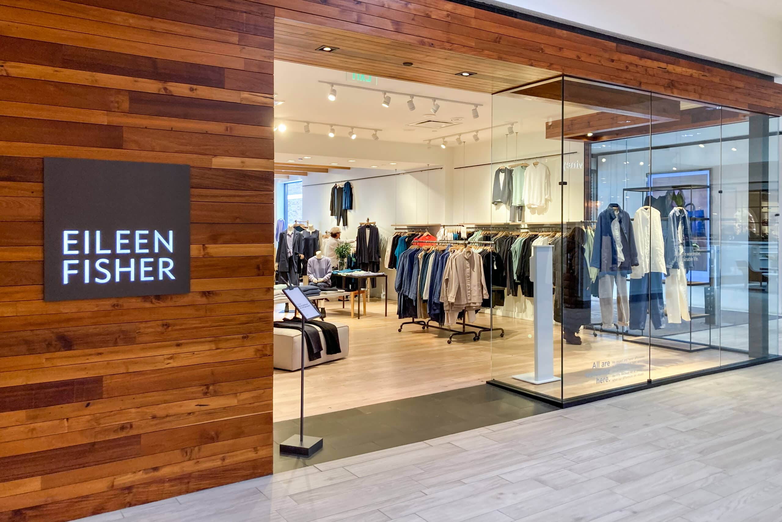 Interior of an Eileen Fisher store featuring the new Aptos ONE POS interface.