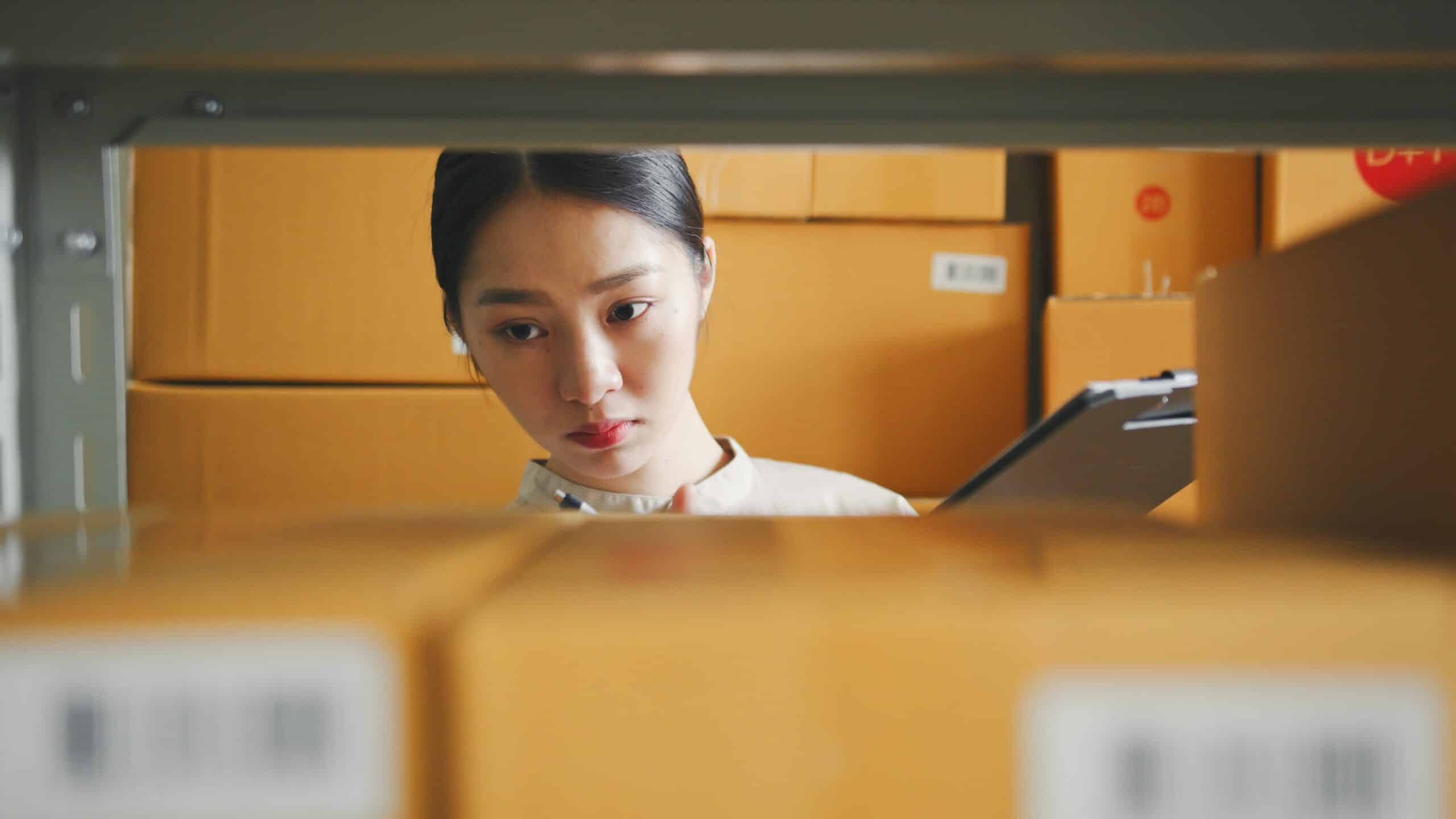 Woman checking retail inventory